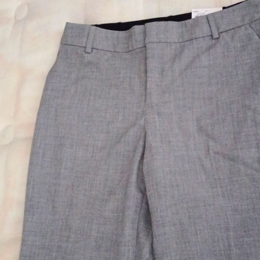 A brand new  mid rise gray dress up pants.